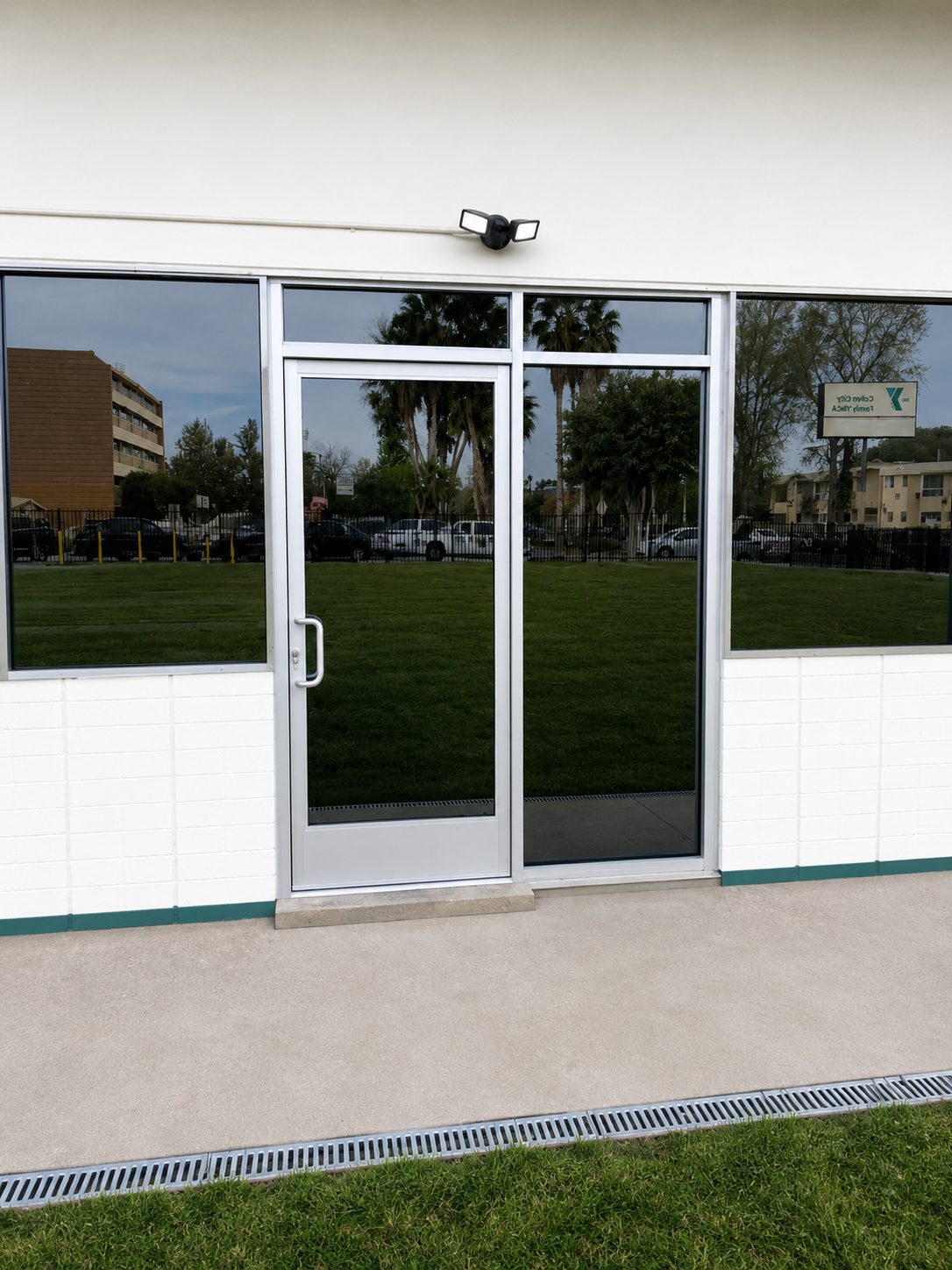 White aluminum commercial storefront and door